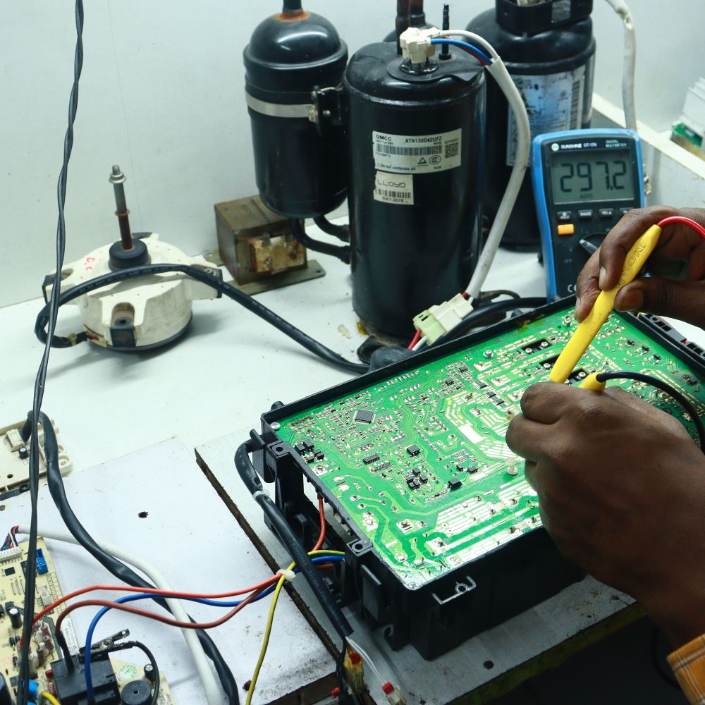 Hoda Enterprises technician repairing an appliance